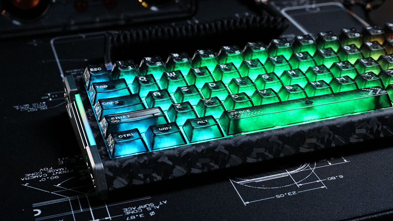 Mechanical keyboard with forged carbon fiber case and glowing green translucent keycaps.