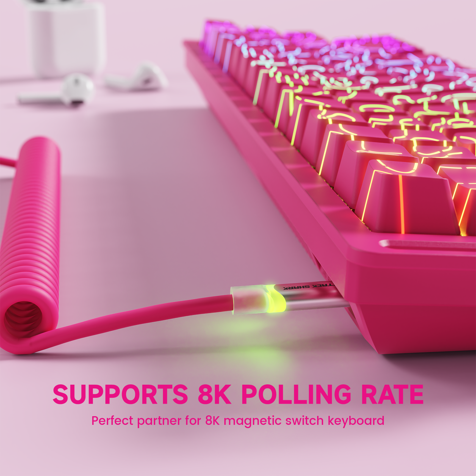 Pink coiled aviator cable connected to a pink mechanical keyboard, highlighting 8K polling rate support.