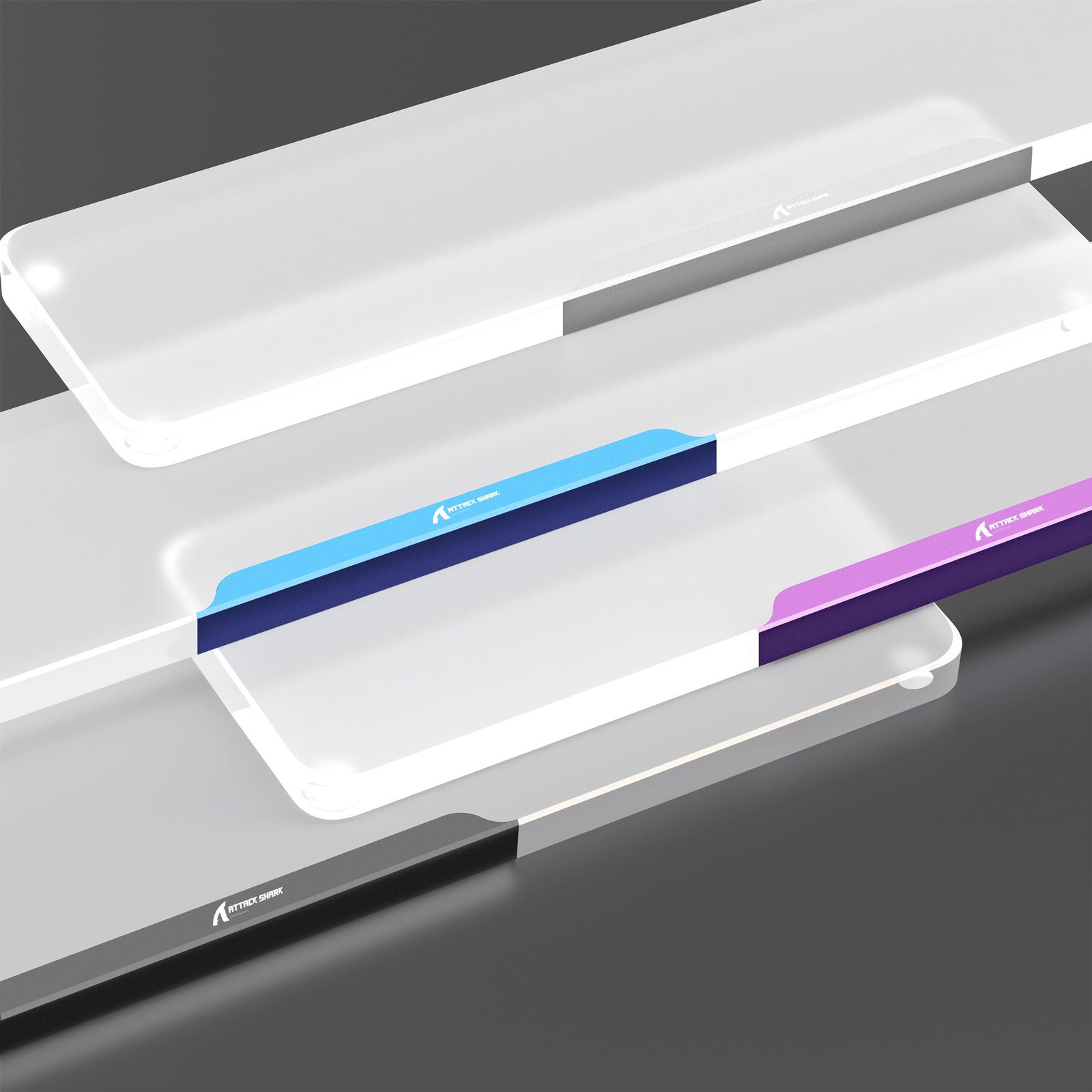 Translucent acrylic wrist rests in gray, blue, and purple with aluminum edges by Attack Shark.