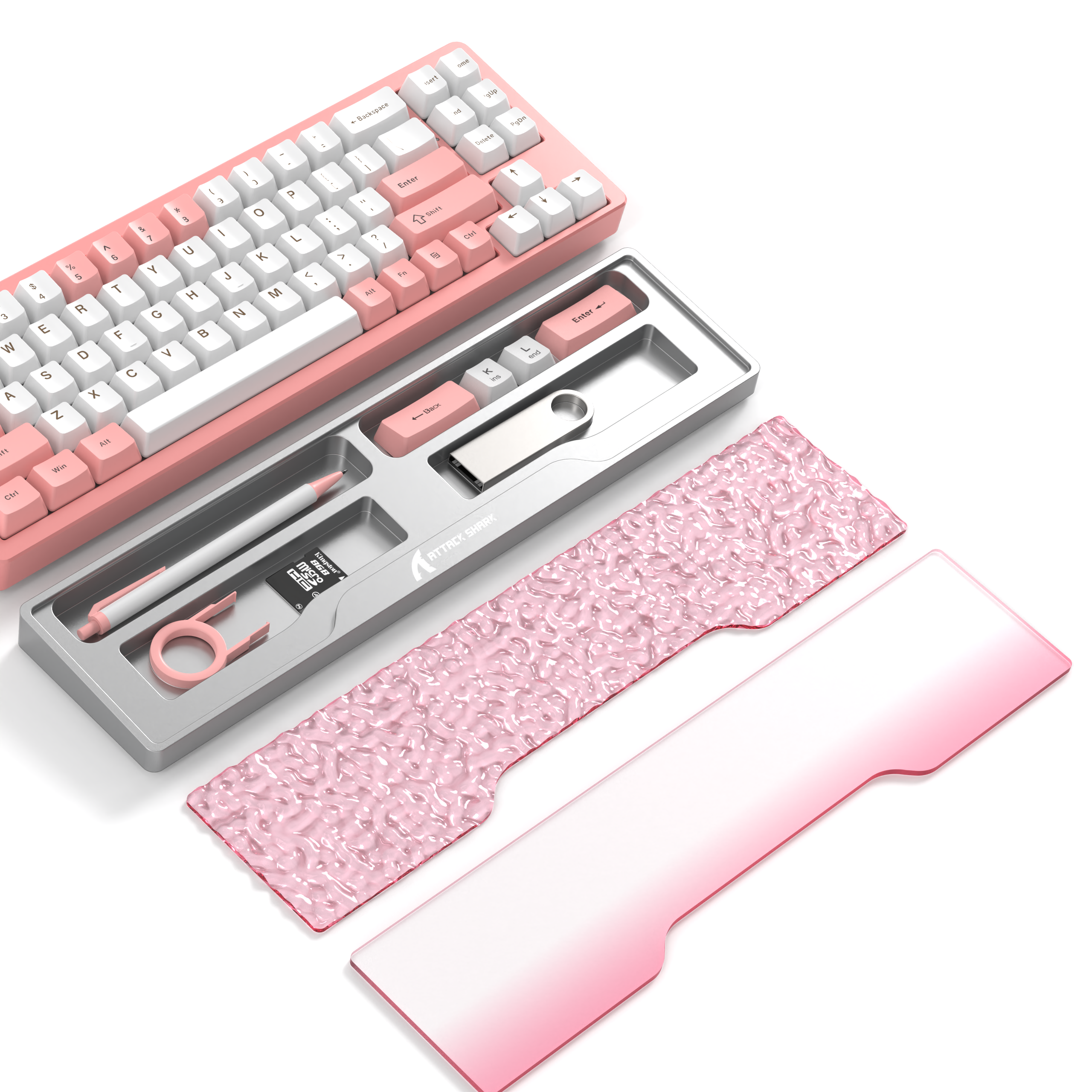 Pink mechanical gaming keyboard with organized accessories in storage tray and interchangeable covers