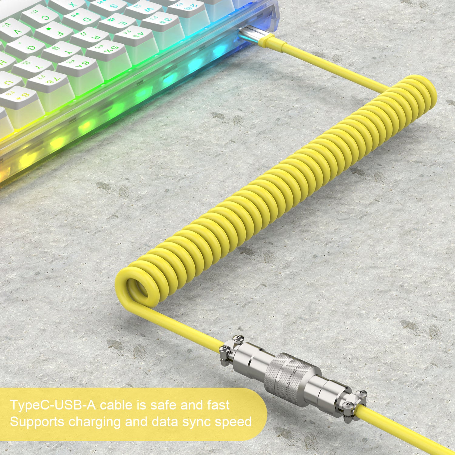 Yellow coiled USB-C keyboard cable with detachable aviator connector and USB-A end.