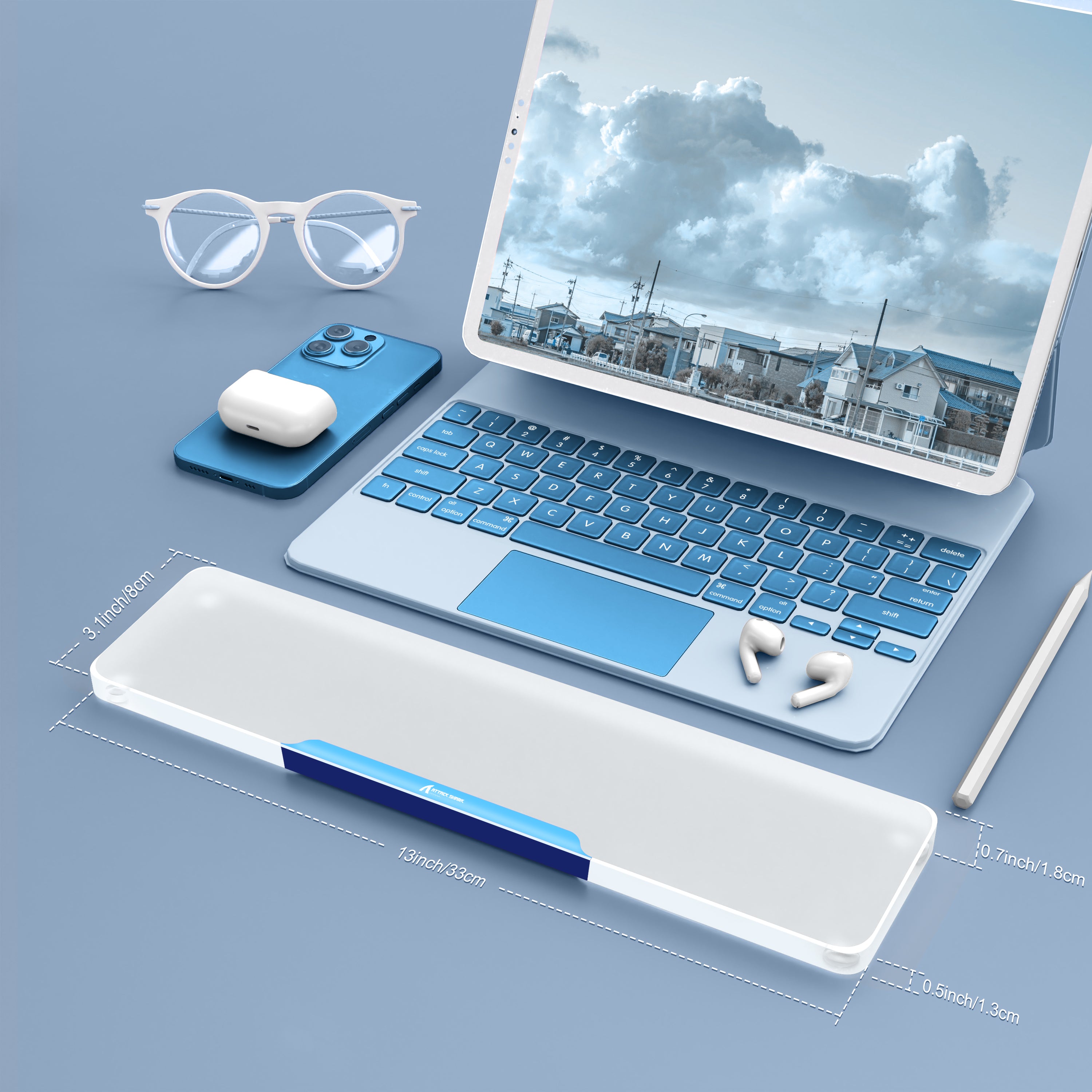 Translucent acrylic wrist rest with blue laptop and glasses on a modern desk for ergonomic support.