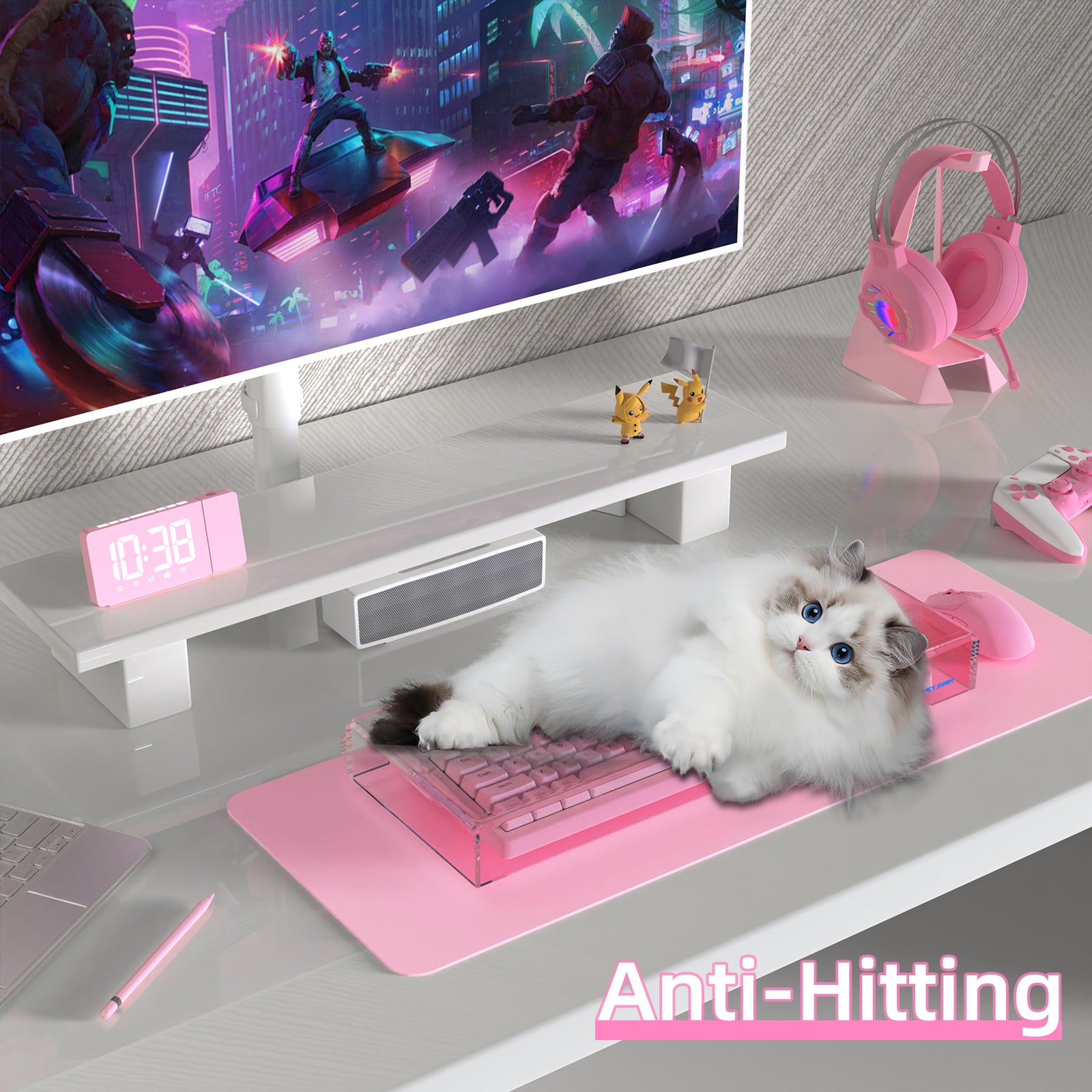 Cat resting on pink keyboard covered with Attack Shark acrylic dust cover in gaming setup.