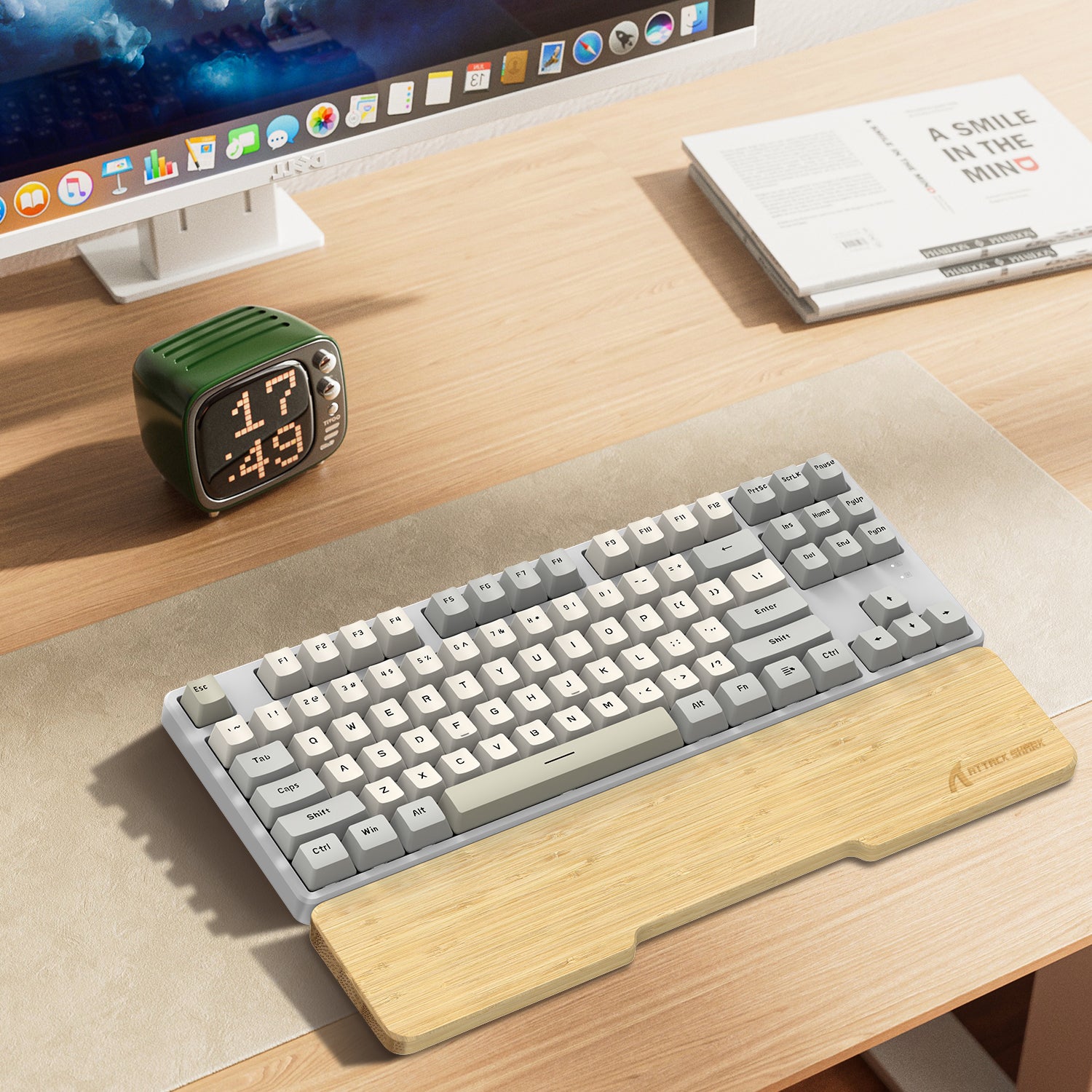 Attack Shark bamboo wrist rest with compact gray and cream mechanical keyboard on wooden desk.