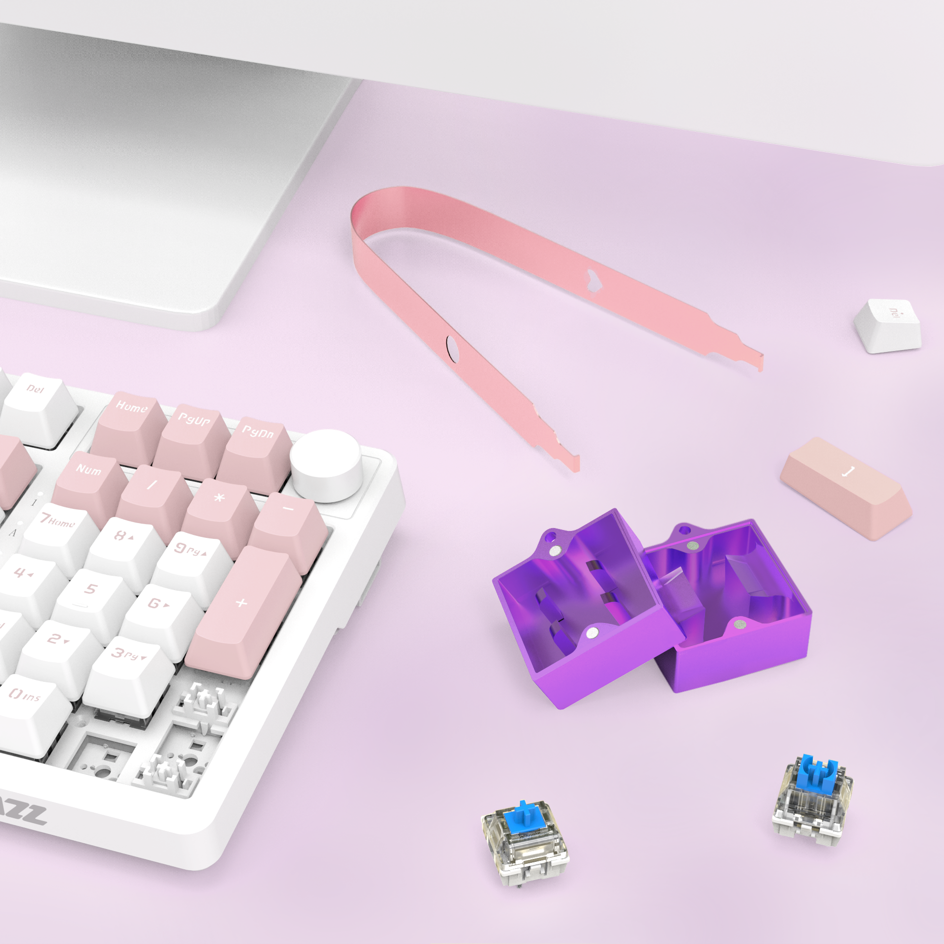 Purple switch opener kit with pink puller next to mechanical keyboard on pink background.