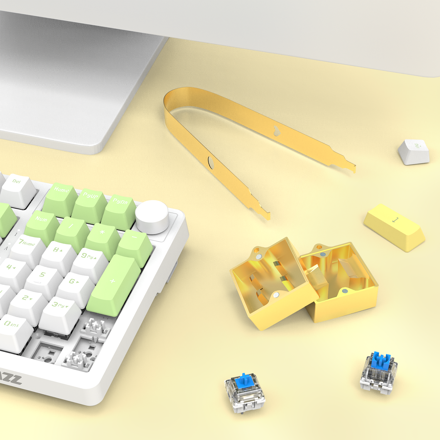 Yellow switch opener kit with puller and mechanical switches on a keyboard.