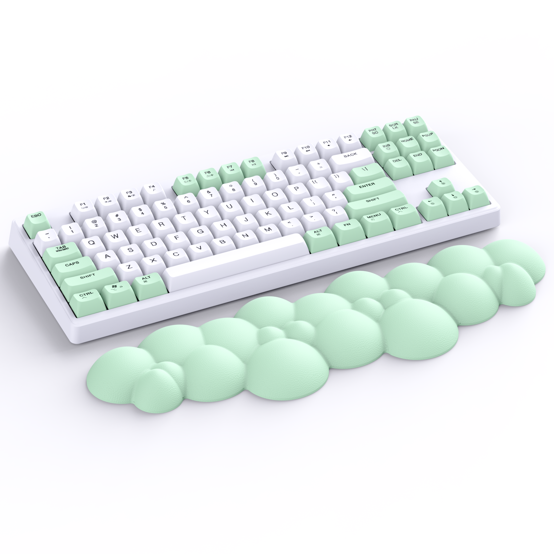 Pastel green cloud-shaped ergonomic wrist rest next to white mechanical keyboard.