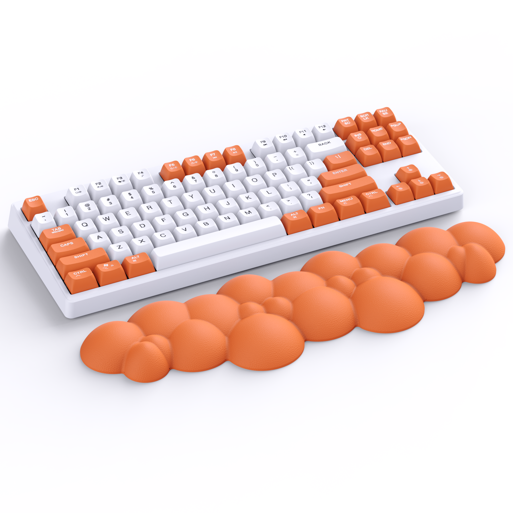 Orange cloud-shaped wrist rest next to a white keyboard with orange keycaps.